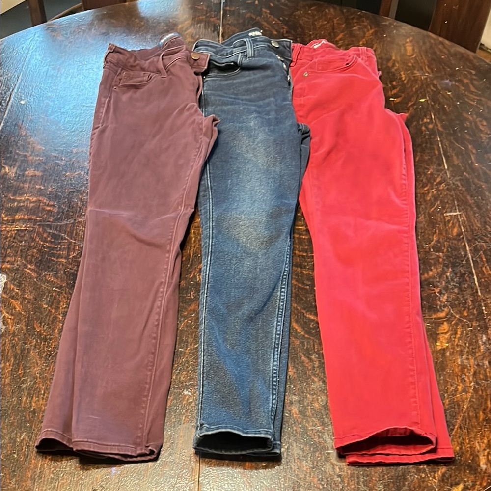 Three pairs of Skinny Jeans in Red, Dark denim, and Purple. Two Old Navy